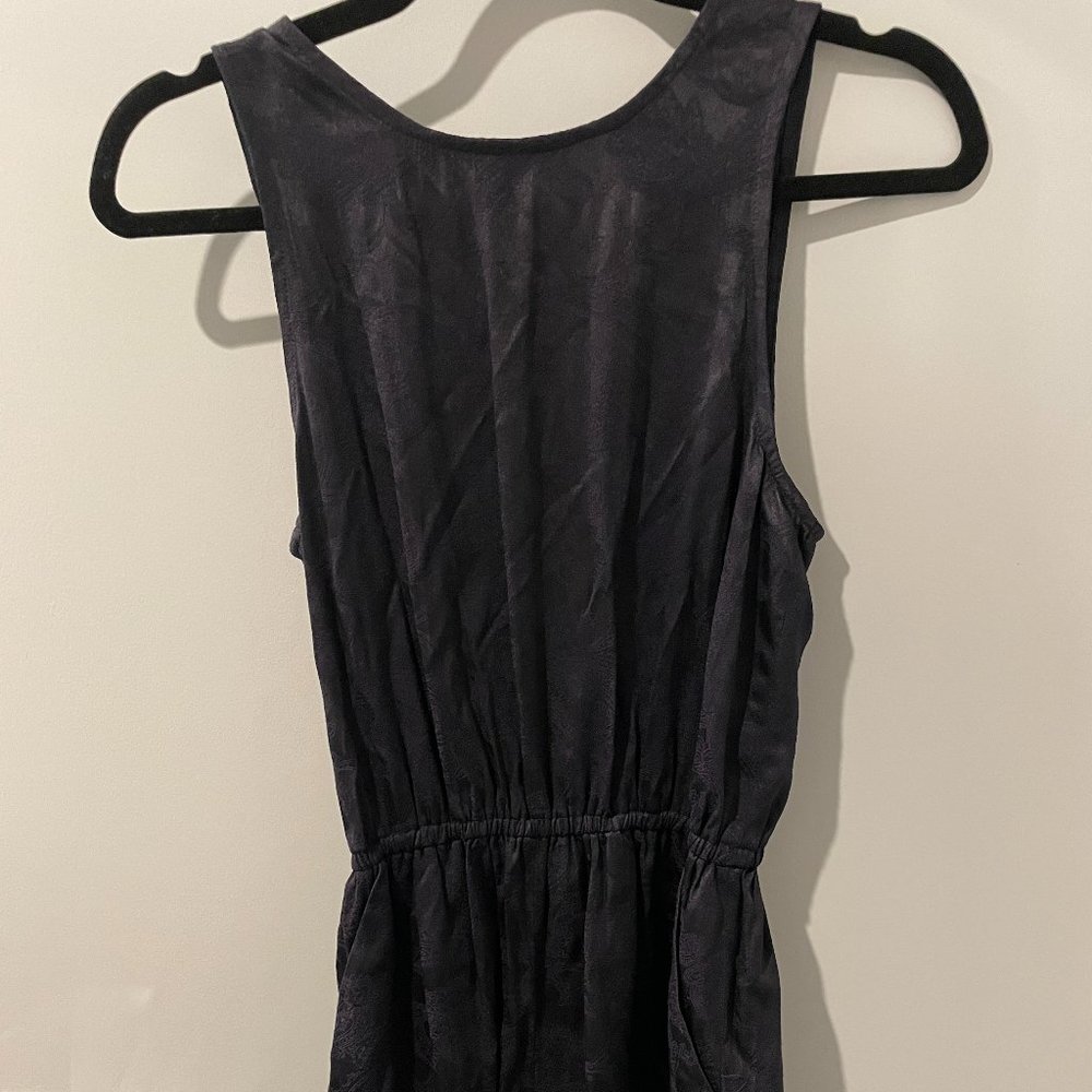 Aritzia black paisley textured romper with an open back